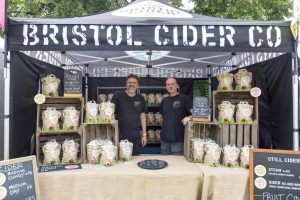 Mark and Jon running the cider stand at a food and drink festival.